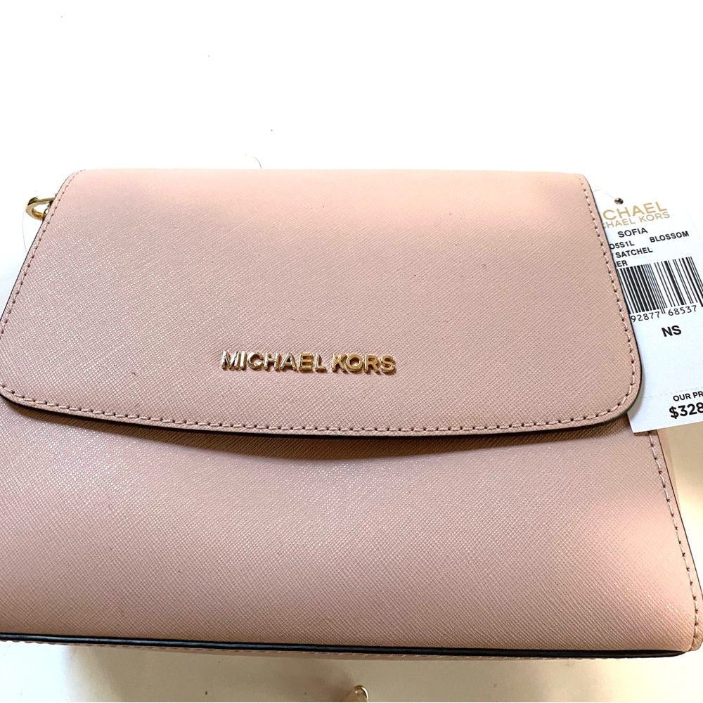 Michael kors bag looks new with tape 9 inches wide
